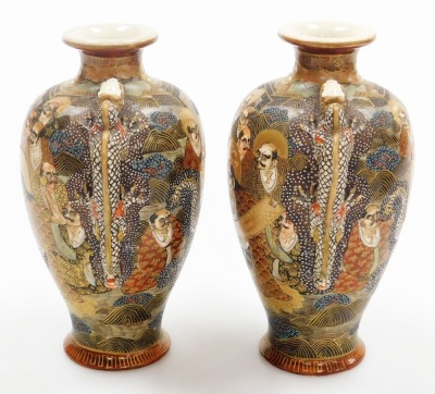 A pair of early 20thC Japanese Satsuma vases, each of baluster form with applied dragon handles, decorated with figures to both sides, marked Dai Nihon Satsuma to underside, 19.5cm high, together with another pair of Satsuma vases of cylindrical tapering - 21