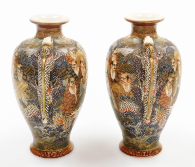 A pair of early 20thC Japanese Satsuma vases, each of baluster form with applied dragon handles, decorated with figures to both sides, marked Dai Nihon Satsuma to underside, 19.5cm high, together with another pair of Satsuma vases of cylindrical tapering - 23