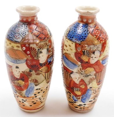 A pair of early 20thC Japanese Satsuma vases, each of baluster form with applied dragon handles, decorated with figures to both sides, marked Dai Nihon Satsuma to underside, 19.5cm high, together with another pair of Satsuma vases of cylindrical tapering - 28