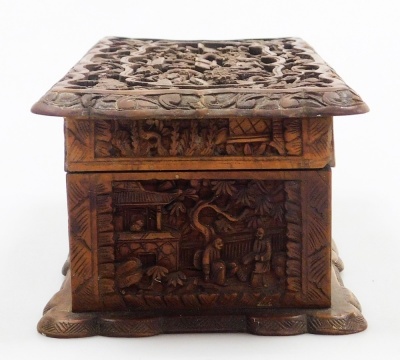 A 20thC Chinese Canton hardwood box, of rectangular shaped form, profusely carved with figures, buildings, trees, etc., the hinged lid enclosing a vacant interior, 25cm wide. - 13