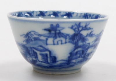 A Nanking Cargo blue and white tea bowl and saucer, painted with a landscape, bears label for Christies lot 5108, together with a 19thC blue and white saucer painted with flowers and foliate scrolls, seal mark, 14cm wide. (3) - 15