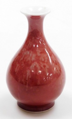 A Chinese sang de boeuf porcelain vase, of baluster form, with an uneven colour, Kangxi six character mark but later, 12.5cm high. - 6