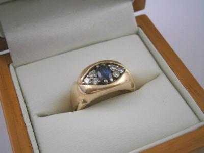 A heavy 18ct gold diamond and a sapphire set ring