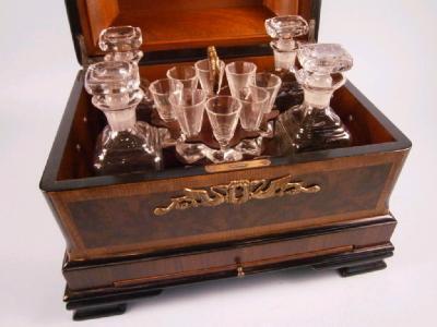 A Continental walnut and marquetry liqueur cabinet