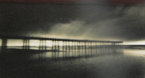 Graham Lowe (20thC). Heavy sky, Saltburn Pier, photograph, signed and titled, label verso, 18cm x 28cm.