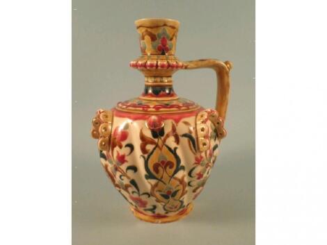 A Zsolnay Pecs ewer decorated in the Persian style with flowers