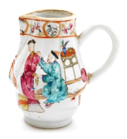 An 18thC Chinese export porcelain sparrow beak jug, painted in coloured enamels of figures on a garden terrace, 9.5cm high.