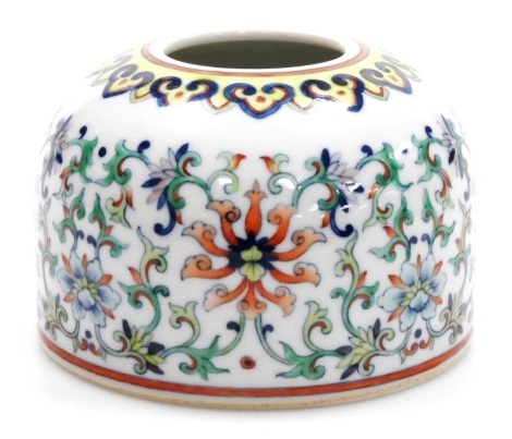 A Chinese doucai porcelain brush pot in 18thC style, decorated in coloured enamels, bearing six character Qianlong mark in underglaze blue, probably 19thC, 6cm high.