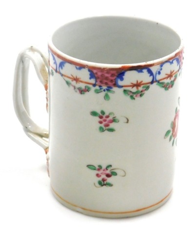 An 18thC Chinese export porcelain mug, decorated with flowers and a repeating decorative upper band, with a double twisted handle, unmarked, 13cm high.