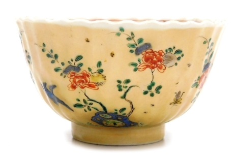 A 19thC Chinese cafe au lait bowl, of fluted form, decorated internally and externally with flowers, blue mark to underside, 9cm diameter.