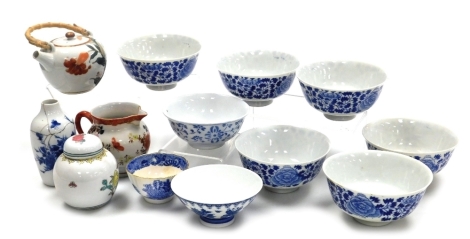 A group of Oriental ceramics, to include a 20thC porcelain miniature ginger jar and cover, decorated with bird and flowers against a white ground, stamped Made in China, 10cm high, various blue and white rice bowls, blue and white vase of tapering form de