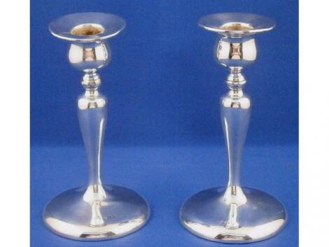 A pair of silver candlesticks