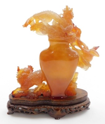 A Chinese agate carving of a vase, enveloped with two dragons and a flaming pearl, terrapin, and a ho-ho bird, raised on a hardwood stand, 21m high, (AF). - 3