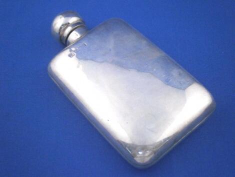 A silver rectangular hip flask with hinged lid