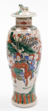 A late 19thC Chinese crackleware vase and cover, of baluster form, the cover with lion dog finial, decorated in green, blue and iron red with warriors, 31m high. (AF)