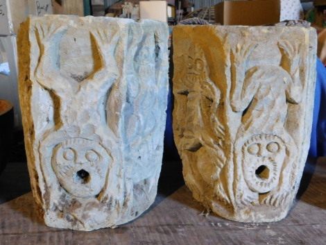 A pair of carved stone water features, decorated with salamanders, frogs, other amphibious creatures, etc., each 34cm high. Note: VAT is payable on the hammer price of this lot at 20%.