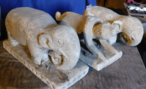 Three stone effect plaster animal figures, comprising two elephants, and a monkey, the largest 30cm wide. Note: VAT is payable on the hammer price of this lot at 20%.
