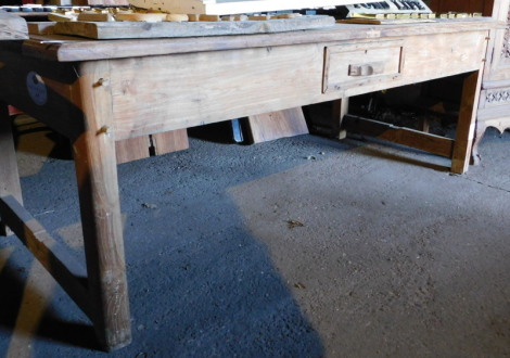 A hardwood kitchen table, the top with a moulded edge above a frieze drawer, on square legs united by stretchers, 75cm high, the top 93cm x 194cm. Note: VAT is payable on the hammer price of this lot at 20%.