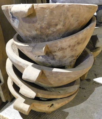 Five hardwood two handled bowls, each approx 67cm wide. Note: VAT is payable on the hammer price of this lot at 20%.