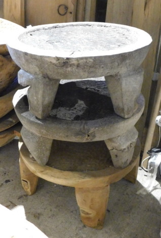 Three hardwood plant stands, each on four carved legs, 27cm high, 59cm diameter. Note: VAT is payable on the hammer price of this lot at 20%.
