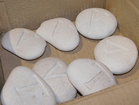 A group of polished rocks, with letters carved to each, to include Z, H, X, W, etc. Note: VAT is payable on the hammer price of this lot at 20%.