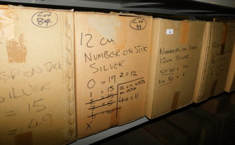 A group of silver and white coloured wooden numbers on sticks, to include 40, 80, etc. (5 boxes) Note: VAT is payable on the hammer price of this lot at 20%.