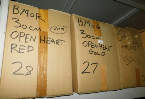 A group of carved wooden open hearts, in gold and red coloured paint, each 30cm high. (3 boxes) Note: VAT is payable on the hammer price of this lot at 20%.