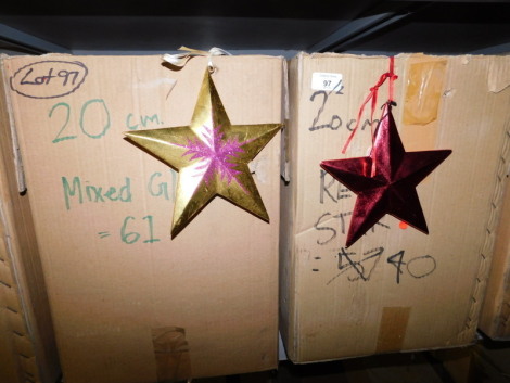 A group of painted wooden star hanging decorations, to include mix glitter, and red glitter etc., each 20cm high. (2 boxes) Note: VAT is payable on the hammer price of this lot at 20%.