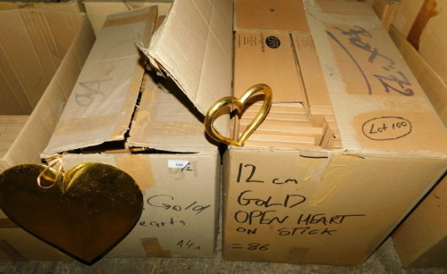 A group of gold painted wooden heart decorations, 30cm high, and a quantity of gold coloured open heart decorations on sticks. (2 boxes) Note: VAT is payable on the hammer price of this lot at 20%.