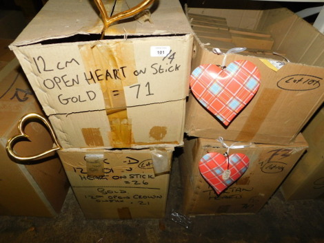 A group of gold coloured open heart decorations on sticks, 12cm high, and a quantity of tartan wooden hearts. (4 boxes) Note: VAT is payable on the hammer price of this lot at 20%.