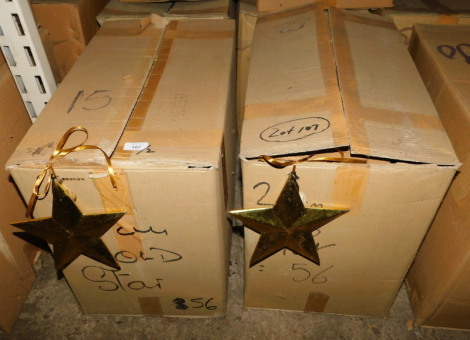 A group of gold coloured wooden star decorations, each 20cm high. (2 boxes) Note: VAT is payable on the hammer price of this lot at 20%.