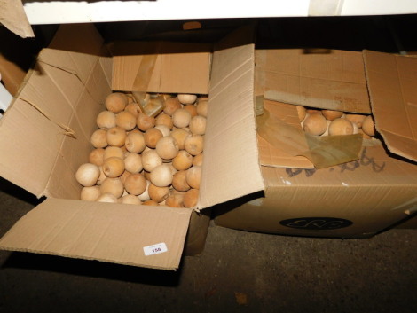 Two boxes of carved wooden apples. Note: VAT is payable on the hammer price of this lot at 20%.