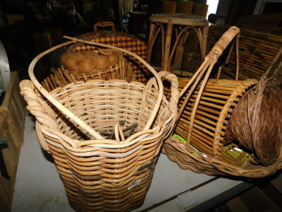 A group of wicker items, to include a two handled log basket, 40cm high, flower basket, 43cm high, bamboo stool, picnic hamper, etc. Note: VAT is payable on the hammer price of this lot at 20%.