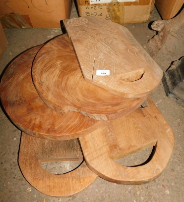 Five reclaimed teak chopping boards, two of circular form, the largest 40cm diameter, and three rectangular with cut out handles. Note: VAT is payable on the hammer price of this lot at 20%.