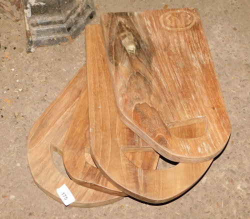 Four reclaimed teak chopping boards, each with a cut out handle, the largest 40cm x 27cm. Note: VAT is payable on the hammer price of this lot at 20%.