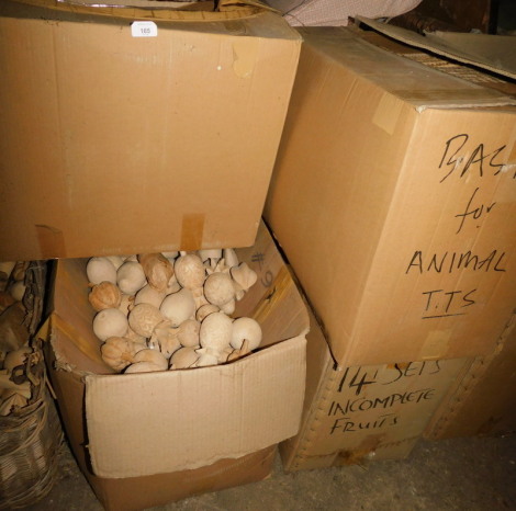 A quantity of carved wooden fruit, to include pumpkins, pineapples, wicker storage baskets, etc. (4 boxes) Note: VAT is payable on the hammer price of this lot at 20%.