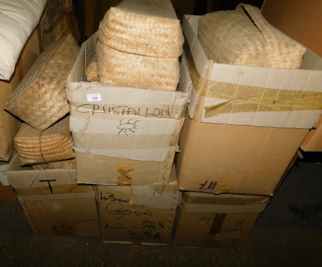 A group of unassembled wooden tree sculptures, each contained in a wicker basket, etc., various sizes. (5 boxes) Note: VAT is payable on the hammer price of this lot at 20%.