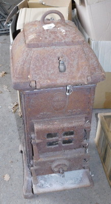 A cast iron stove, 76cm high..