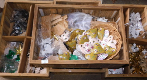 A quantity of carved wooden decorations, to include painted hearts, 9cm high, gold coloured painted leaves, mushrooms, painted eggs, mainly on ribbons, contained in four wooden crates. Note: VAT is payable on the hammer price of this lot at 20%.