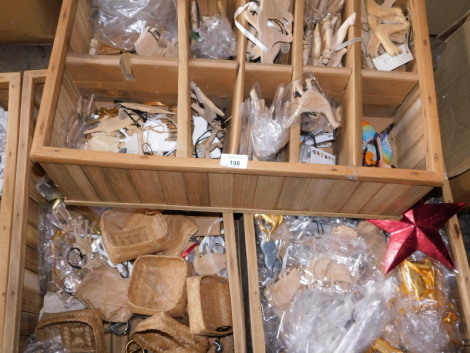 A quantity of carved wooden decorations, to include painted birds, pig figure, 6cm high, hedgehogs, deer, etc., contained in three wooden boxes. Note: VAT is payable on the hammer price of this lot at 20%.