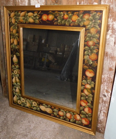 A wall mirror, the frames painted with fruit with a gilt inner and outer border, 93cm x 82cm. Note: VAT is payable on the hammer price of this lot at 20%.