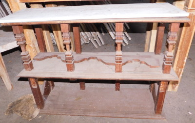 An Eastern hardwood two tier cabinet, with carved pilasters, and a white marble top, 73cm high, 100cm wide, 34cm deep. Note: VAT is payable on the hammer price of this lot at 20%.