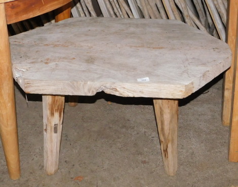 A reclaimed hardwood coffee table, the top of hexagonal form, on tapering legs, 45cm high, the top 67cm x 94cm. Note: VAT is payable on the hammer price of this lot at 20%.