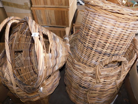 A quantity of wicker baskets, to include log basket of cylindrical form with four ring handles, 74cm high, laundry basket of oval form with two handles, lidded laundry basket, etc. (a quantity) Note: VAT is payable on the hammer price of this lot at 20%.