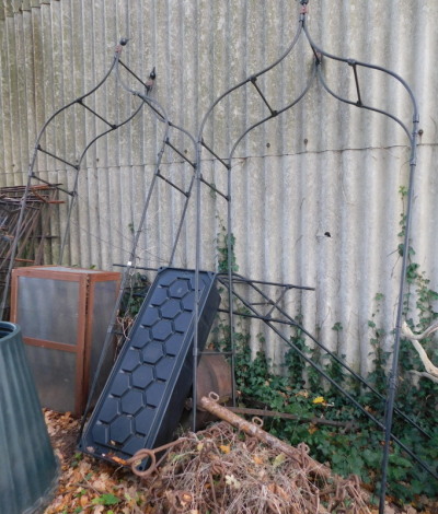 Three metal framed garden arches, each 104cm wide, approx 260cm high. (1 unassembled) Note: VAT is payable on the hammer price of this lot at 20%.