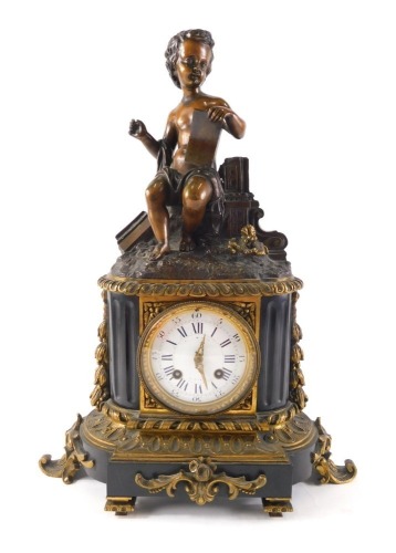 A late 19thC French bronze slate and gilt metal figural mantel clock, the top mounted with a seated putto holding a tablet, above a white enamel dial with Roman numerals on a shaped base, 43cm high.