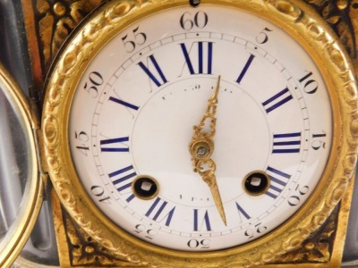 A late 19thC French bronze slate and gilt metal figural mantel clock, the top mounted with a seated putto holding a tablet, above a white enamel dial with Roman numerals on a shaped base, 43cm high. - 4