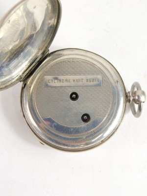 A 20thC open faced pocket watch, with Roman numeric and Arabic dial, gilt coloured pointers, with 4cm diameter enamel face, in plain case with vacant cartouche, key wind movement, white metal, 7cm high. - 3