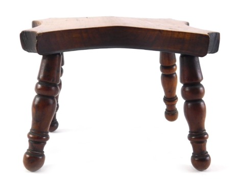 A 19thC yew miniature stool, with concave top and turned legs, 17cm wide.