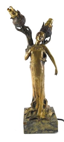 Jeanne Jozon (1868-1946). A female figural lamp base, with flower heads, gilt bronze on a marble base, signed to reverse (AF), 36cm high. WARNING! This lot contains untested or unsafe electrical items. It is supplied for scrap or re-conditioning only. TR